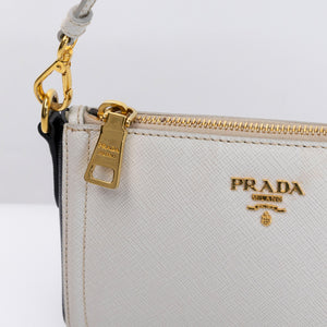 PRADA SAFFIANO LEATHER MINI POCHETTE BAG WHITE / BLACK GHW
