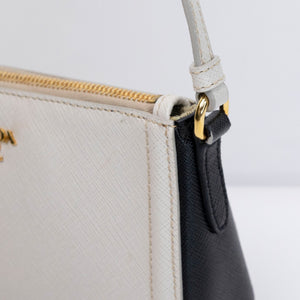 PRADA SAFFIANO LEATHER MINI POCHETTE BAG WHITE / BLACK GHW