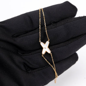 CHAUMET JEUX DE LIENS PENDANT GOLD , MOTHER OF PEARL , DIAMOND
