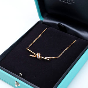 TIFFANY KNOT PENDANT IN YELLOW GOLD WITH DIAMONDS