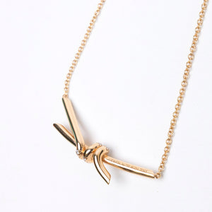 TIFFANY KNOT PENDANT IN YELLOW GOLD WITH DIAMONDS